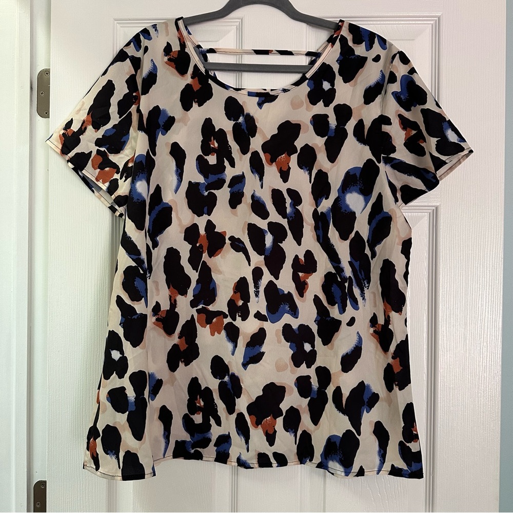 2X leopard print top with strappy v back and cobalt blue highlights